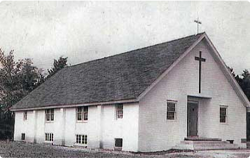 A photo of the original church house.